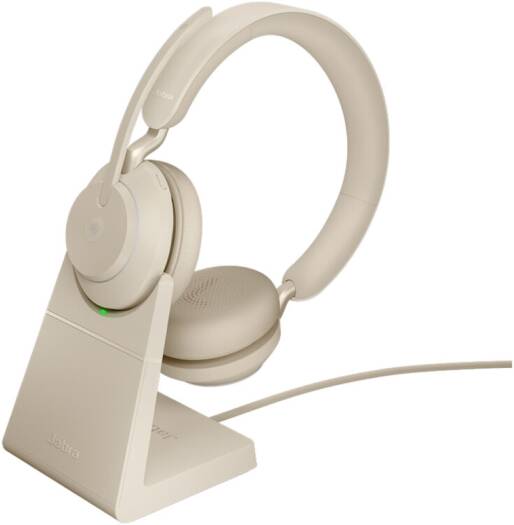 Jabra Evolve2 65 UC Stereo Wireless Headset with Link 380a and charging stand, featuring advanced noise isolation, powerful 40 mm speakers, three-microphone call technology, soft memory-foam ear cushions, and an elegant beige finish.