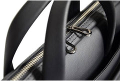 Port Designs ZURICH laptop bag for 14"–15.6" laptops in black, featuring a large front zippered pocket, padded interior, and an adjustable, removable shoulder strap.