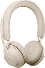Jabra Evolve2 65 UC Stereo Wireless Headset with Link 380a and charging stand, featuring advanced noise isolation, powerful 40 mm speakers, three-microphone call technology, soft memory-foam ear cushions, and an elegant beige finish.