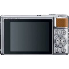 Canon PowerShot SX740 HS digital camera featuring 40× optical zoom, a 3-inch tilt LCD screen, 4K video recording, built-in Wi-Fi, NFC, and Bluetooth connectivity, in silver.